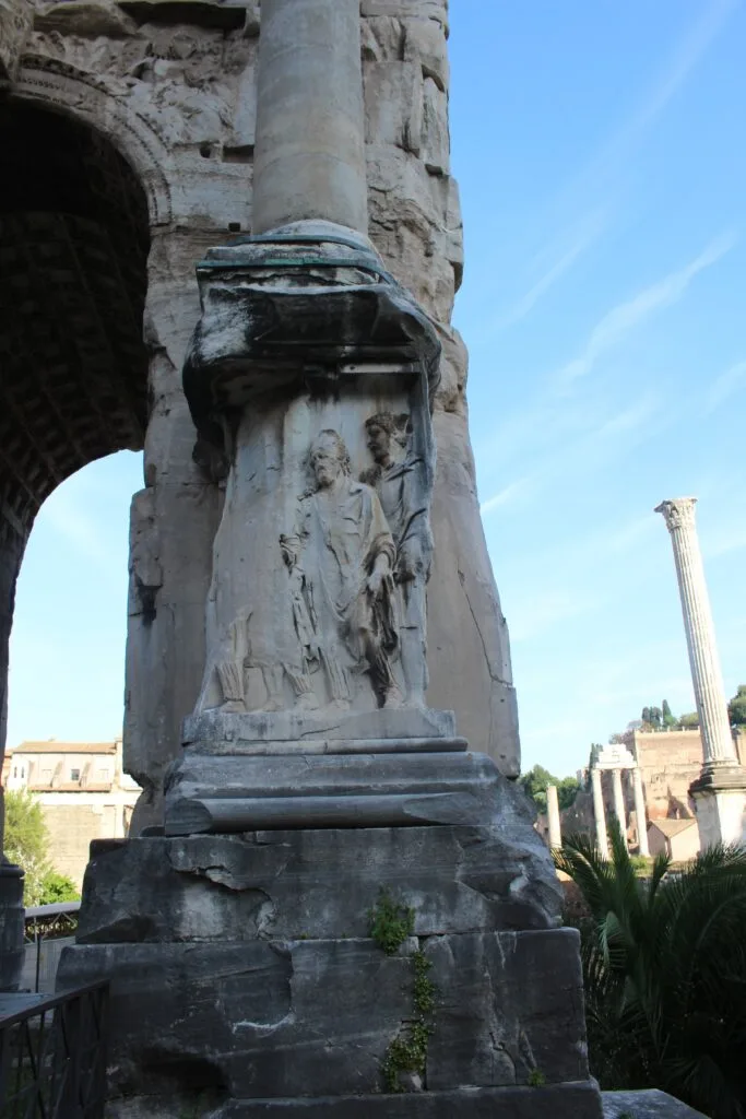 Stone carving and architectural details at the base of a column.