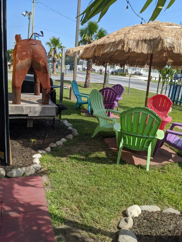 Souvenir store: Colorful Adirondack chairs out front