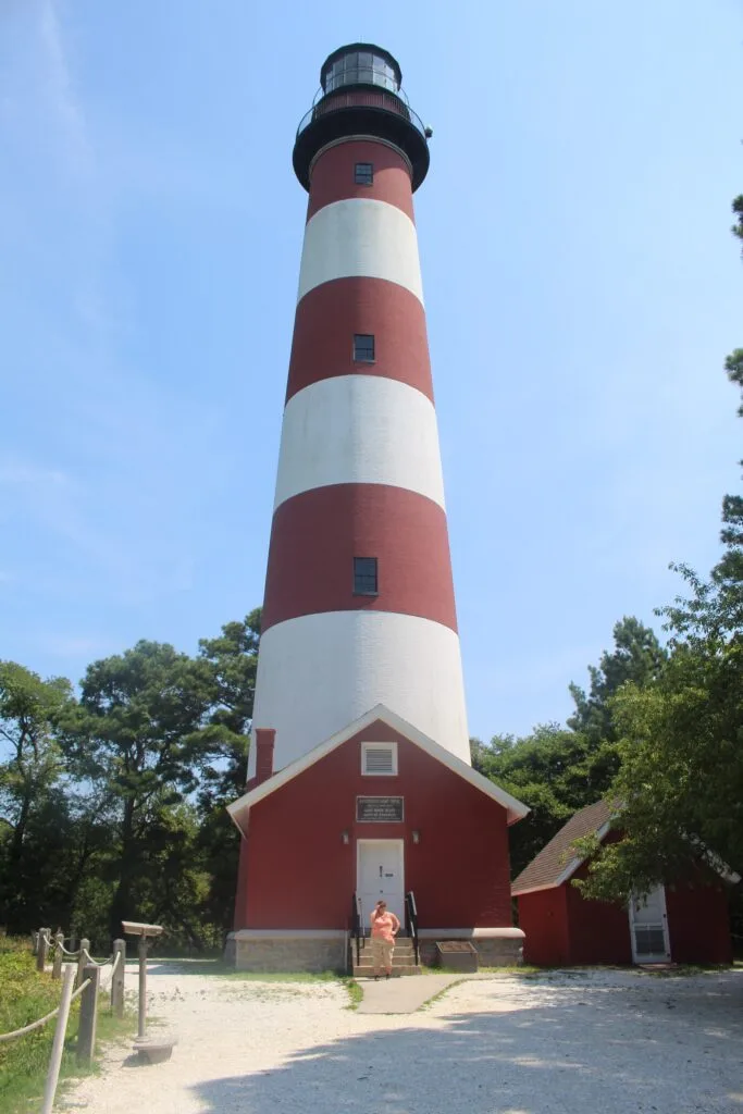 Me in front of the Assateague Lighthouse, one of the top things to do in Chincoteague, Virginia. 