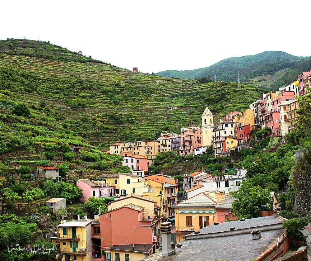 A view of the vineyards and Old Manarola. Exploring Old Manarola is one of the best things to do in Manarola, Italy. 