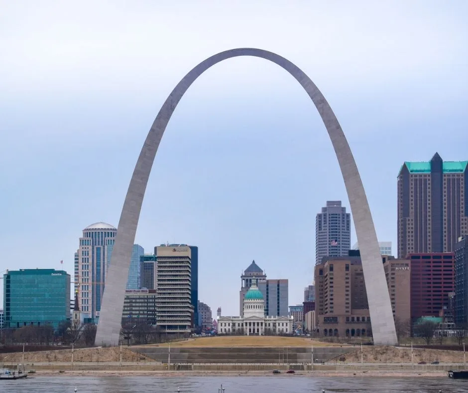 The Gateway Arch in St. Louis, Missouri, with the city skyline in the background.