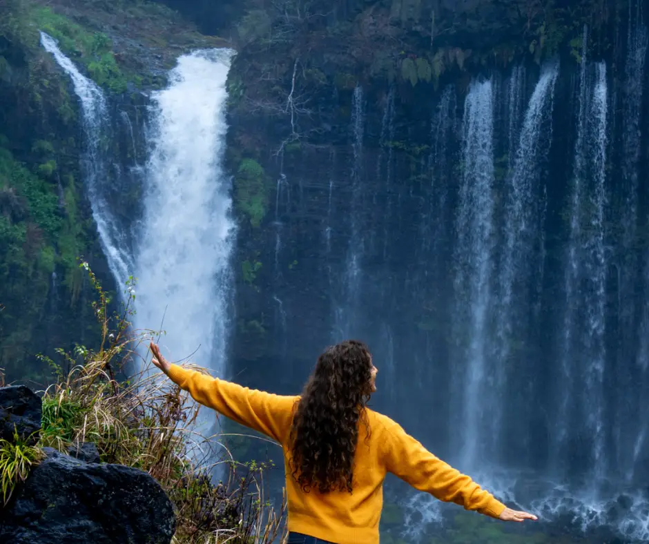 Standing at one of the observation decks while visiting Shirato Falls, Japan