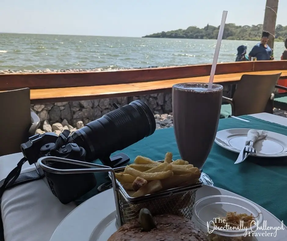 My burger, fries and chocolate milkshake overlooking the lake at 2Friends Beach Hotel, Entebbe. 