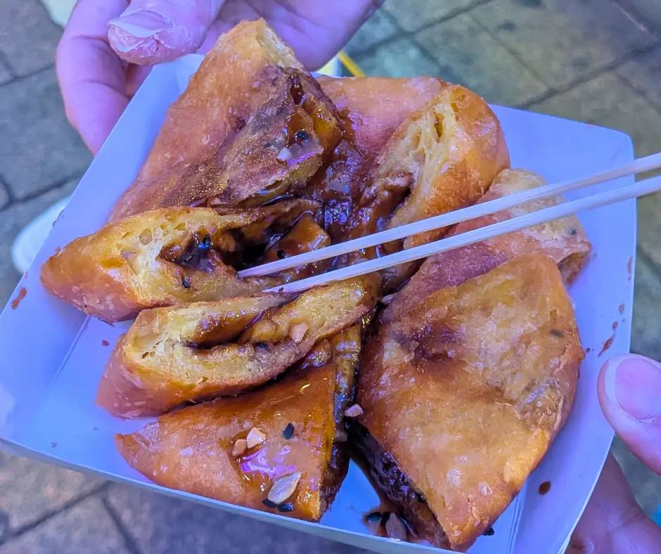 Eating street food like this hotteok is one of the best things to do in Seoul, South Korea. 
