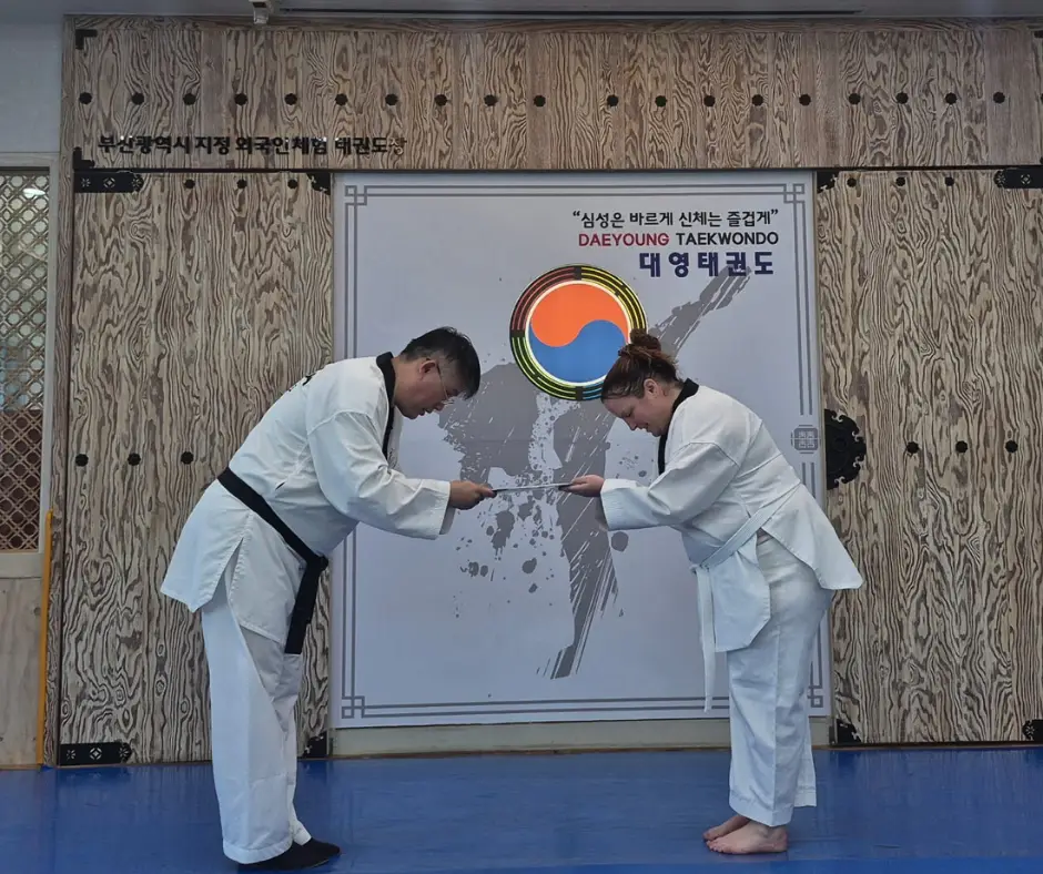 Me getting my taekwondo certificate in South Korea
