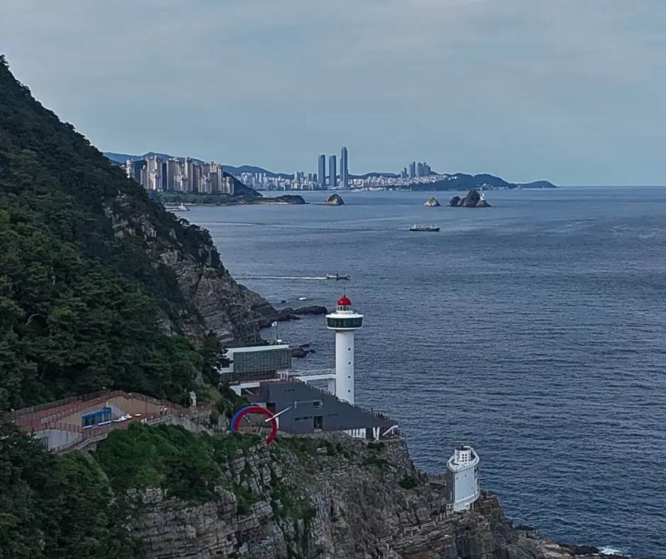 Drone photo of Taejongdae Resort Park with the cliffs and city. 