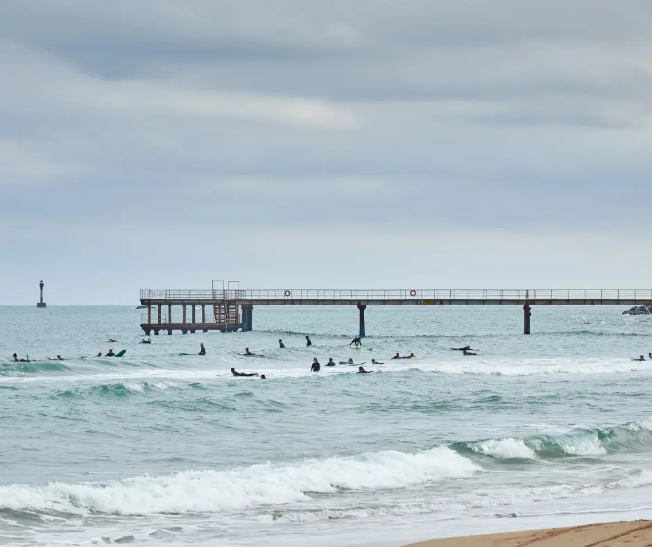 Surfers at Songjeong Beach in Busan. Photo by Deposit Photos